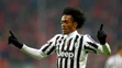 Kolumbijský stredopoliar Juventusu Juan Cuadrado oslavuje svoj gól a druhý Turína počas odvety osemfinále LM proti Bayernu