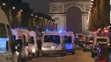 Na snímke policajné autá sú na bulvári Champs-Élysées v centre francúzskeho hlavného mesta Paríž, kde došlo k streľbe.