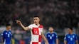 Chorvát Ivan Perišič reaguje v dueli s Talianskom na ME 2024.