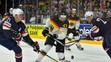 Američania Dylan Larkin (vľavo) a Anders Lee stíhajú Nemca Gerrita Fausera na MS 2017.