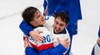 Na snímke hokejisti Slovenska zľava Juraj Slafkovský a Tomáš Jurčo po výhre nad Švédskom.