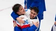 Na snímke hokejisti Slovenska zľava Juraj Slafkovský a Tomáš Jurčo po výhre nad Švédskom.