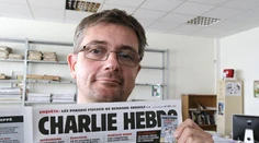 Šéfredaktora Charlie Hebdo pochovala len rodina a priatelia