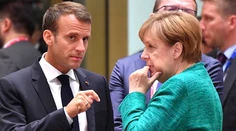 Merkelová a Macron sú presvedčení, že rokovania o brexite sú v záverečnej fáze