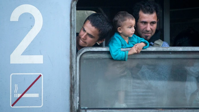 Migranti vo vlaku.