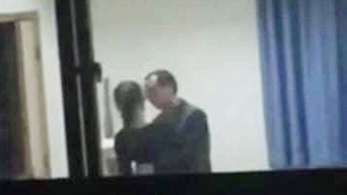 28223E8E00000578-3061013-Abuse_of_power_The_maths_teacher_known_as_Mr_Xu_leans_in_as_the_-m-73_1430324015998.jpg