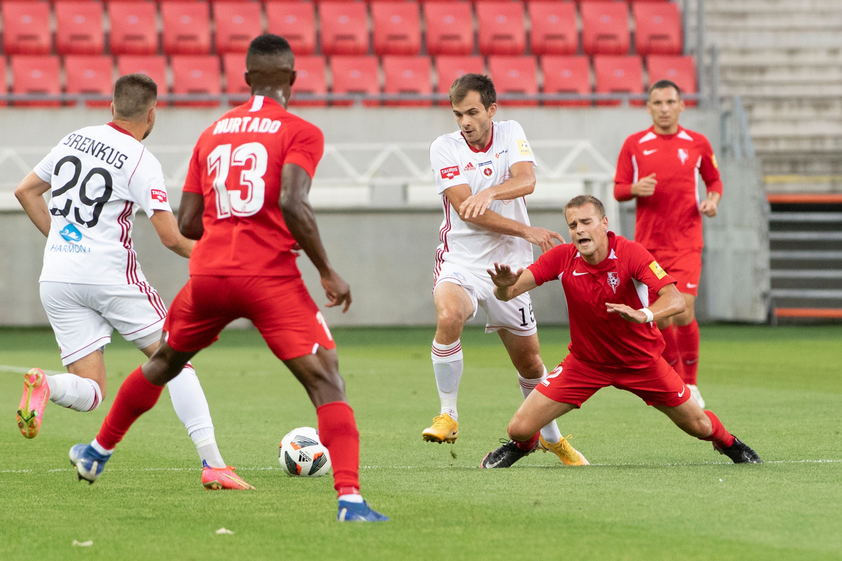 Vpravo Denis Potoma (Sereď), druhý sprava Štefan Gerec a Adam Brenkus (obaja Ružomberok) v zápase Fortuna ligy.