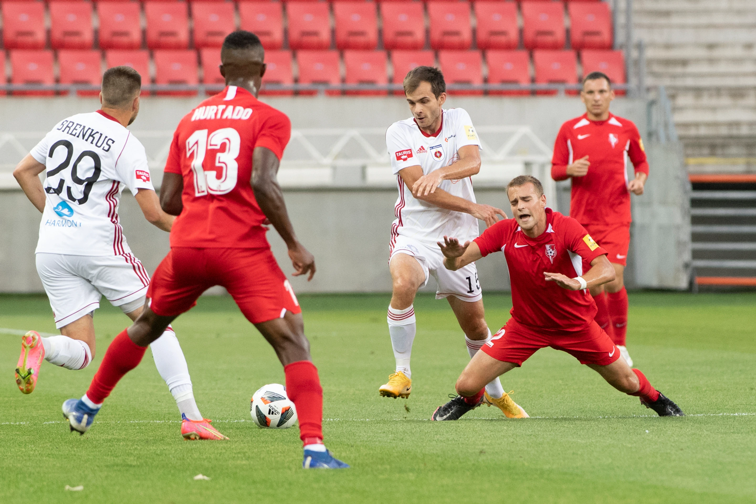 Vpravo Denis Potoma (Sereď), druhý sprava Štefan Gerec a Adam Brenkus (obaja Ružomberok) v zápase Fortuna ligy.