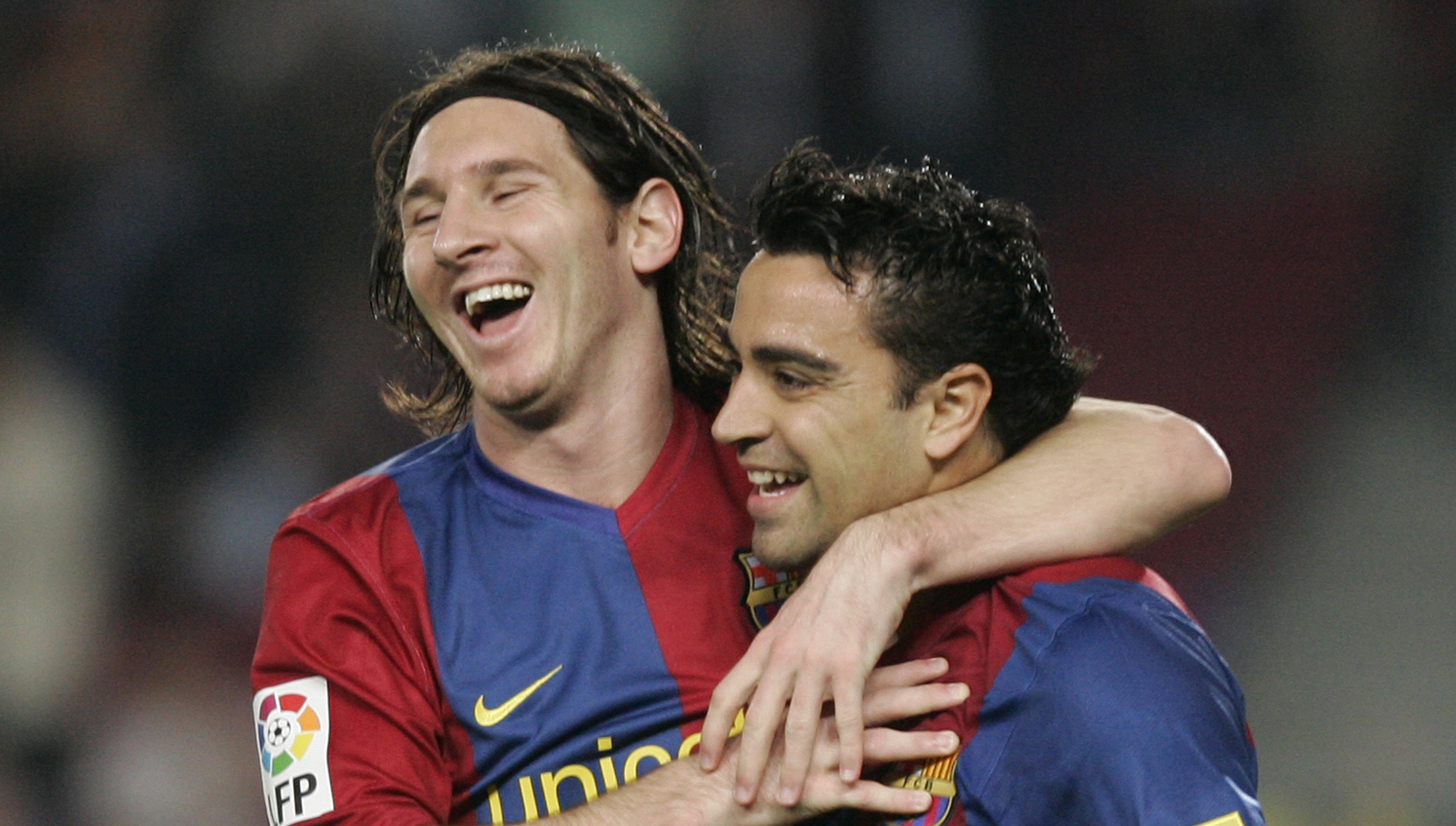 Xavier "Xavi" Fernandez oslavuje s Lionelom Messim gól (archívna snímka)