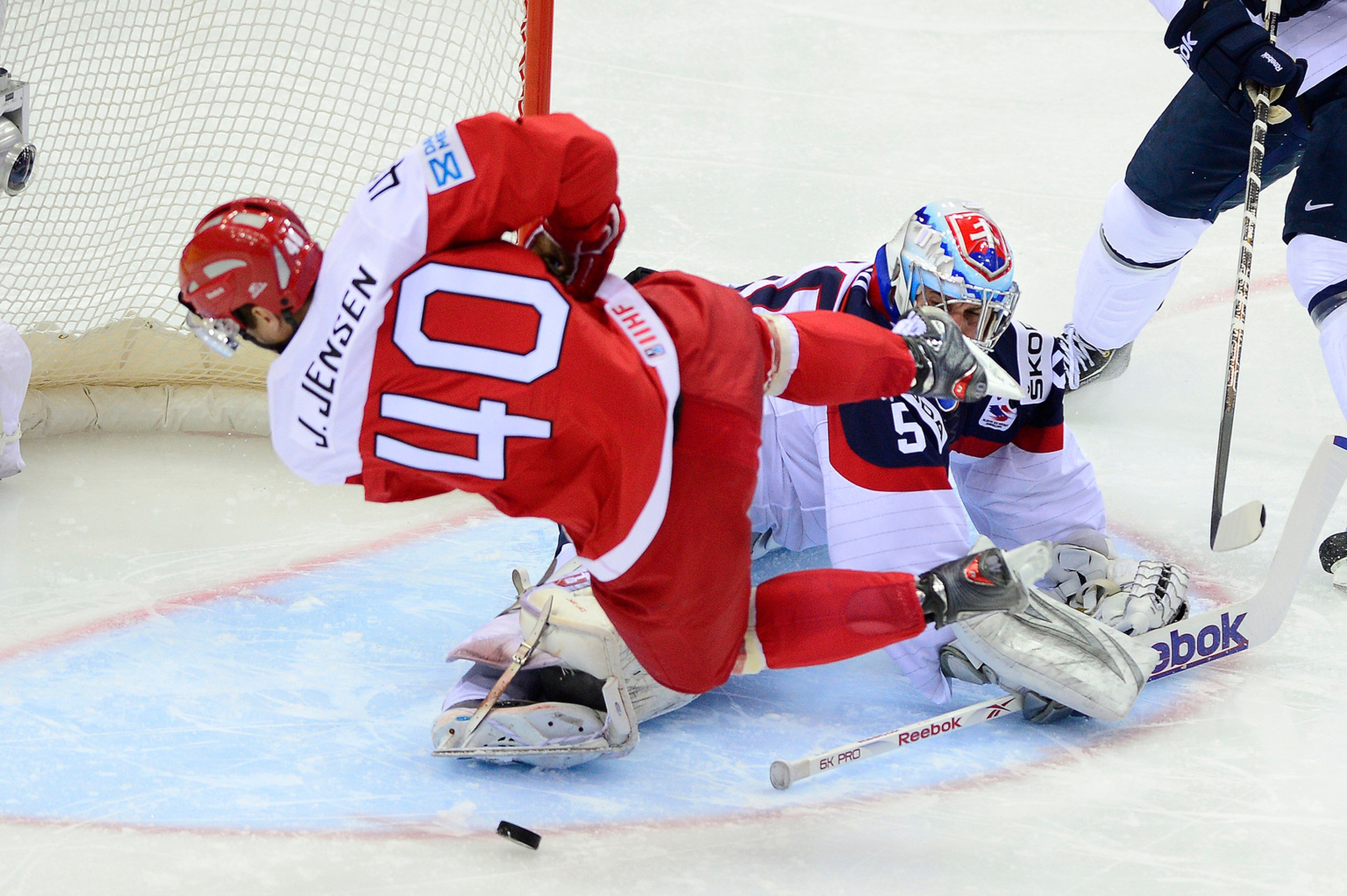Na snímke brankár Slovenska Ján Laco  a vľavo Jesper Jensen z Dánska.