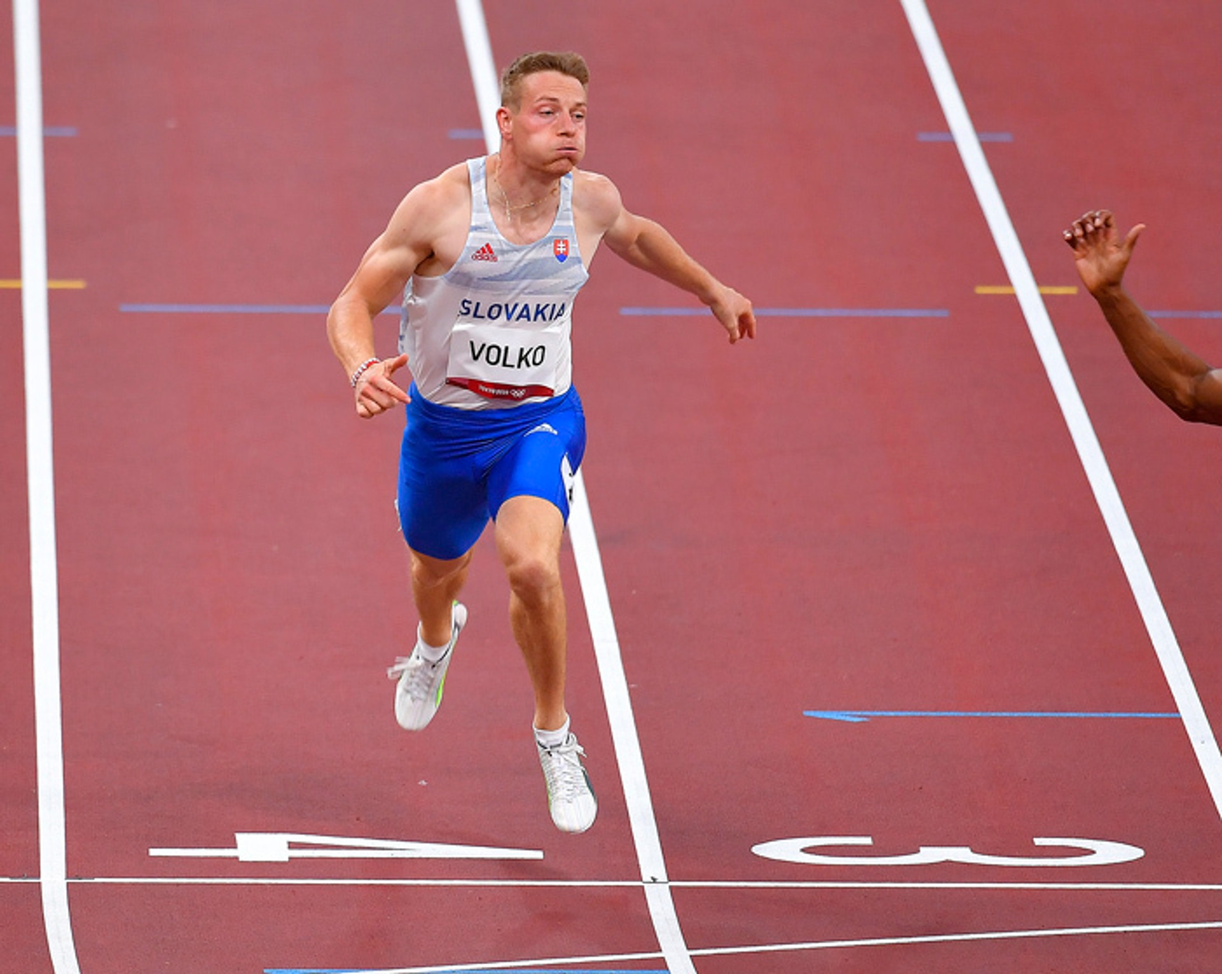 Ján Volko počas rozbehu na 100 metrov na OH.
